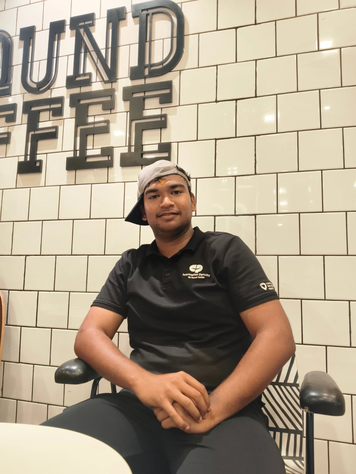 Professional headshot of a developer in a dark setting